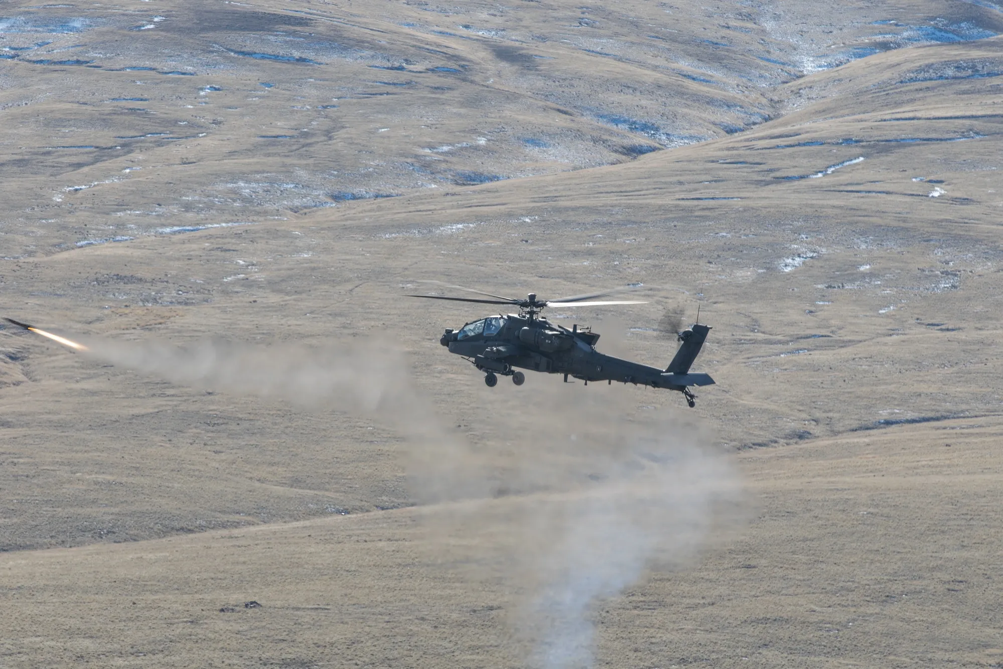 Apache firing Hellfire missile in flight (wide)