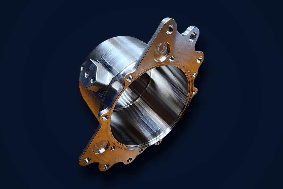 Turn-milled stainless bore housing